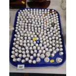 A collection of thimbles, thimble stands and a ceramic deer. (1 tray)