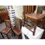 A set of four oak dining chairs, wooden bottle rack, bathroom cabinet, and a brass fire screen. (7)
