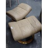 Two Ekornes stressless leather footstools.