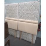 A divan king size bed, comprising two bed bases, mattress and headboards.