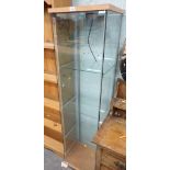 A glass pillar display cabinet.