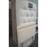 A divan single bed, with brown material base, cream headboard, and a Next 1500 pocket sprung mattres