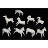 A group of Chinese export blanc de chine figures of horses, in various standing poses. (9, AF)