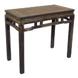 A Chinese elm side table, with a carved frieze, raised on square legs, 80cm high, 91cm wide, 48cm de