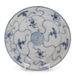 An early 19thC Tek Sing ship wreck blue and white porcelain dish, decorated in a lotus pattern, bear