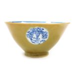 A Qing dynasty blue and white and cafe-au-lait porcelain tea bowl, of tapering form decorated intern