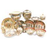 A group of Satsuma pottery, including a twin handled jardiniere, plates and dishes, figure of a cat,