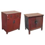 A Chinese red stained cupboard, with two frieze drawers over a pair of cupboard doors enclosing a si