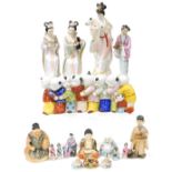 A group of 20thC Oriental figures, including a Satsuma seated Buddha, box and cover, a line of porce