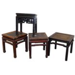 Four Chinese hardwood square occasional tables, two with rattan tops, each raised on square legs.