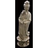 An 18thC style blanc de chine floor standing figure, of a Guanyin standing in flowing robes holding