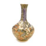 A Meiji period Japanese Satsuma vase, of long necked, bottle form, decorated all over with birds, bu