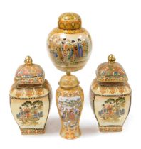 A pair of Satsuma vases and covers, of square curved form, decorated with reserve panels of figures