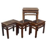 Four Chinese rectangular hardwood occasional tables, variously carved, raised on square legs,