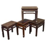 Four Chinese rectangular hardwood occasional tables, variously carved, raised on square legs,