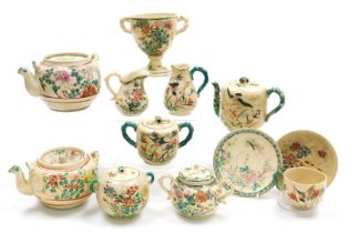 A group of early 20thC Japanese Satsuma teawares, decorated with flowers and birds, including teapot