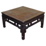 A Chinese elm occasional table, with a carved frieze, raised on square legs, 50cm high, 90cm wide, 8