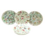 Four 19thC Chinese celadon and famille rose plates, decorated with birds, butterflies, and flowers,