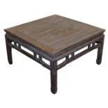 A Chinese elm occasional table, with a carved frieze, raised on square legs, 50cm high, 88cm wide, 8