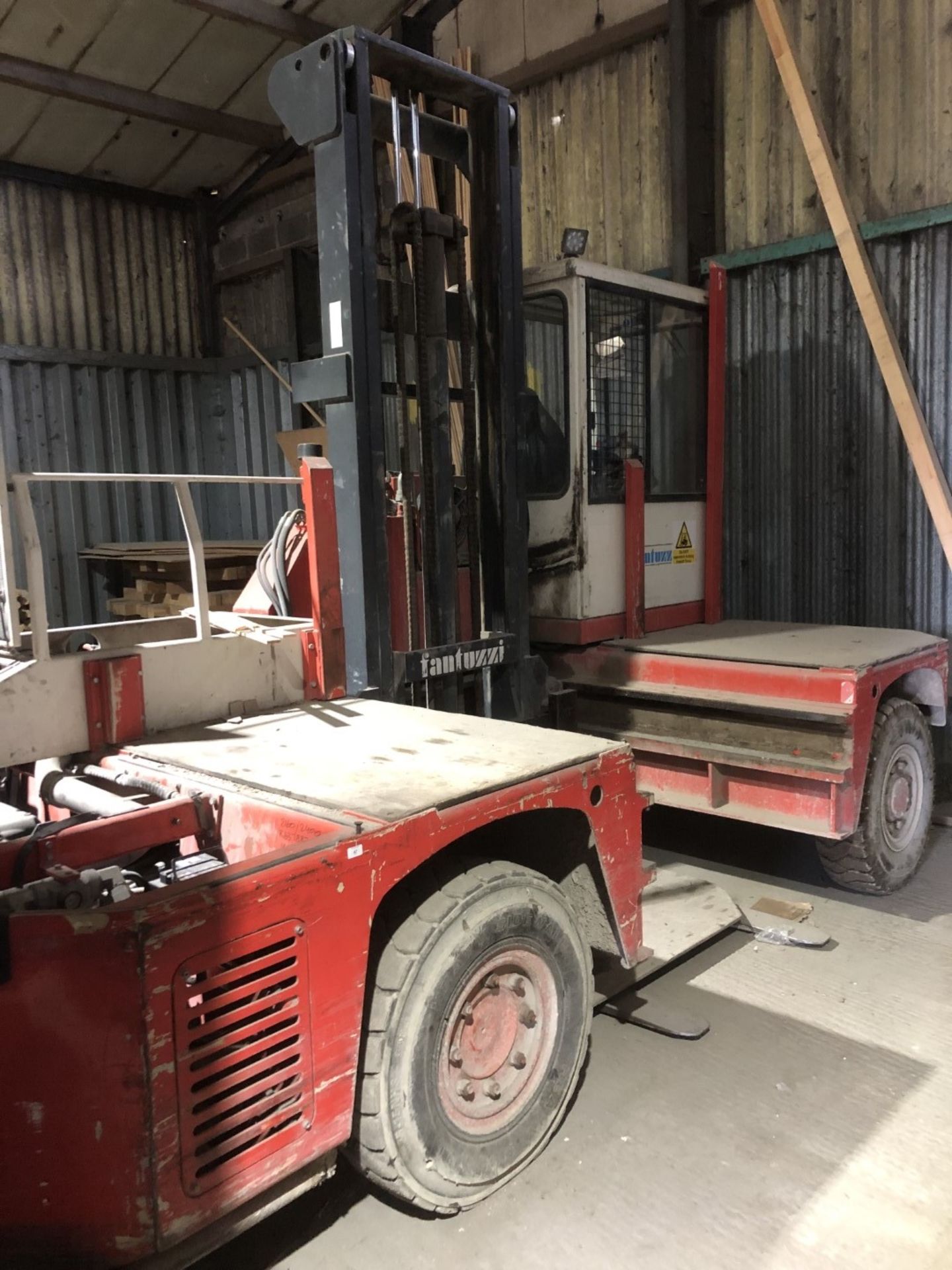 A Fantuzzi side loader forklift - red.