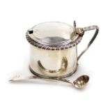 A George IV silver mustard pot, with a gadrooned rim and blue glass liner, William Knight II, London