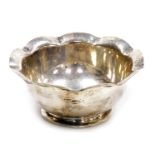 A Victorian silver sugar bowl, with a wavey rim, foliate engraved, James Deakin & Sons, Sheffield 18