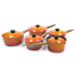 Four Le Creuset graduated saucepans, with lids, together with a milk pan. (5)