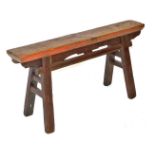 A Chinese elm trestle bench, raised on outswept square legs, 48cm high, 94cm wide, 29cm deep.