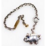 A de Grisogono silver and 18ct gold keyring, with a pig fob, set with a blue stone set eye, with pou