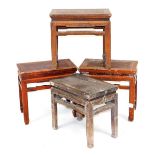 Four Chinese hardwood occasional tables, of rectangular section, raised on square legs, 44.5cm-50cm