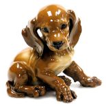 A Rosenthal porcelain figure of a Dachshund puppy, modelled by Theodore Korner, number 1274, impress