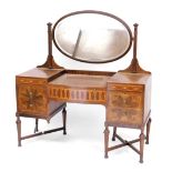 An early 20thC mahogany and inlaid dressing table, the oval swing frame mirror inset bevelled glass,
