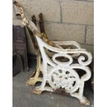 A Victorian white painted cast iron bench frame, with two side panels, decorated with thistles and l