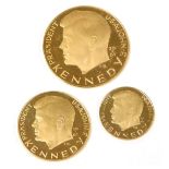 Three German Issue JF Kennedy gold commemorative coins, marked for .900 fineness, the obverse with a