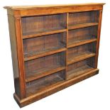 A Victorian mahogany open bookcase, bisected, with six shelves, raised on a plinth base, 120cm high,