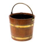An oak and brass bound coal bucket, with metal liner, 37.5cm high.