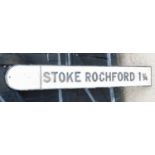A vintage black and white cast iron road sign, for "Stoke Rochford 1¼", 121cm wide.