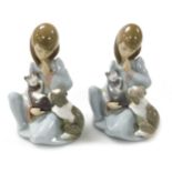 A pair of Lladro porcelain figures, each modelled as a seated girl with a puppy and kitten.