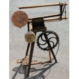 An early 20thC Hobbies cast iron treadle action fret saw, 84cm high.