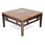 A Chinese hardwood occasional table, with a galleried sides, raised on square legs, 50cm high, 93cm