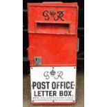 A George VI red painted cast iron Post Office letter box, with lot plate and sign below, with notice
