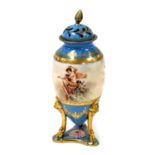 A late 19thC Bohemian pot pourri vase and cover, decorated with a goddess and cherubs, within a turq