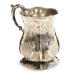 A Victorian silver tankard, of fluted baluster form, with a foliate scroll and harebell embossed ha