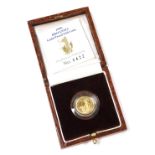 A 1996 Britannia gold proof £10 coin, boxed with certificate, approximately 3.41g.