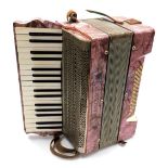 A late 19thC German Francesco piano accordion, with pink simulated mother of pearl casing and forty-