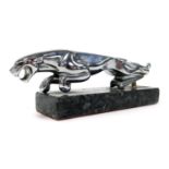 A Jaguar chrome car mascot, raised on a marble base, 19cm wide.