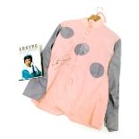 A Lester Piggott racing silk jacket, in pink and lilac, signed, together with Lester, The Autobiogra