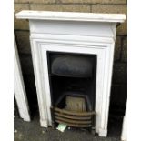 An Edwardian cast iron and white painted wooden bedroom fire surround, 110cm x 68cm.