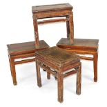 Four Chinese hardwood occasional tables, of rectangular section, raised on square legs, 48cm-50cm hi