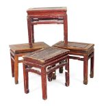 Four Chinese hardwood occasional tables, of rectangular section, raised on square legs, 49cm-50cm hi